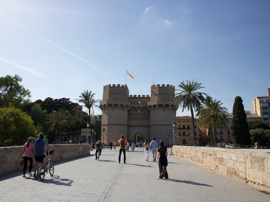 Tourists at Torres de Serranos medieval city gate Valencia