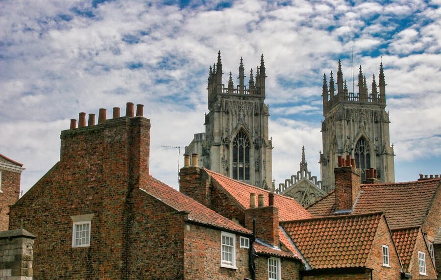 York Minster towers above red brick rooftops