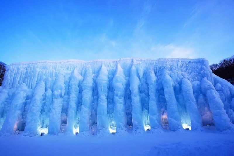 Dreamy ice sculptures decorated with lights-Lake Shikotsu Ice Wave Festival half-day tour at nightfall from Sapporo - Two Hours to Explore the Festival